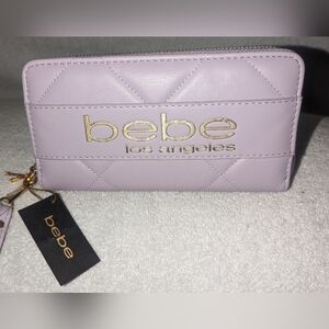Bebe Vivian lilac wristlet wallet.
